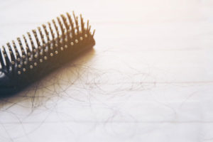 Losing Your Hair? 7 Reasons Why & What to Do About it